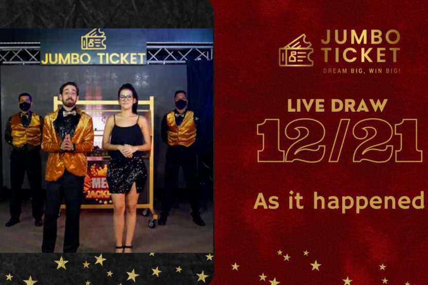 Peter and Sharon presenting Jumbo Ticket December 2021 Live Draw