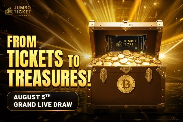 Jumbo Ticket Grand Live Draw - From Tickets to Treasures! A treasure chest filled with gold coins and a ticket on a grand stage background.