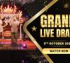 Hosts presenting the Jumbo Ticket Grand Live Draw on stage, with a "Grand Live Draw" banner and the date, October 5, 2024.