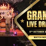 Hosts presenting the Jumbo Ticket Grand Live Draw on stage, with a "Grand Live Draw" banner and the date, October 5, 2024.